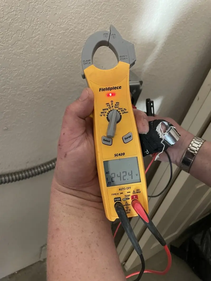 Voltage testing with clamp meter during Electrical Installation Services in Toppenish